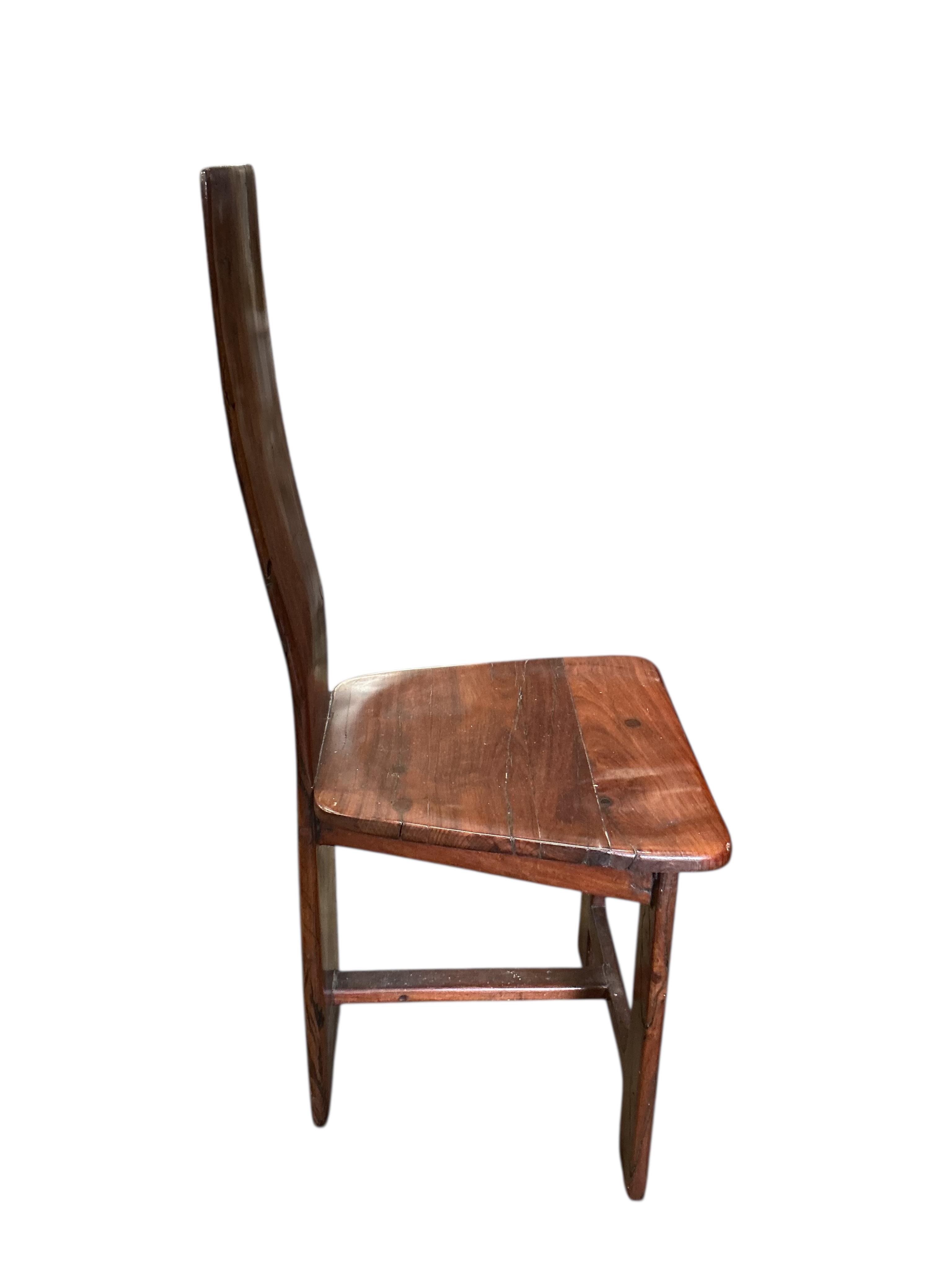 A Zimbabwean reclaimed Jarrah railway sleeper hardwood circular pedestal dining table, diameter 170cm, height 75cm and eight chairs by Rail Antiques, Harare, each piece stamped Rail Antiques